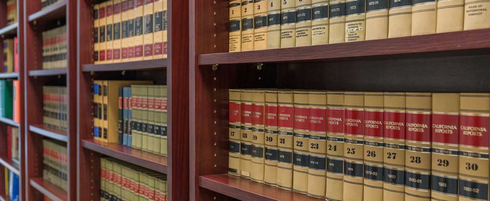 A shelf of bound law books in the firm's library, covering every practice area