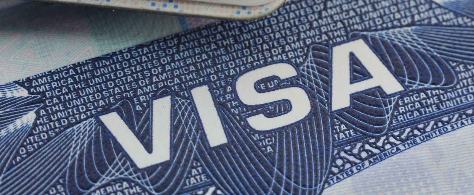 A close-up of a United States visa, the document at the center of a family visa petition
