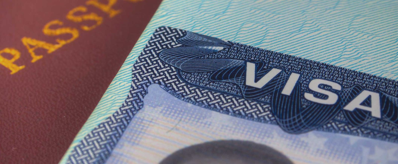 A passport open to a United States visa page, the permission behind a temporary visa