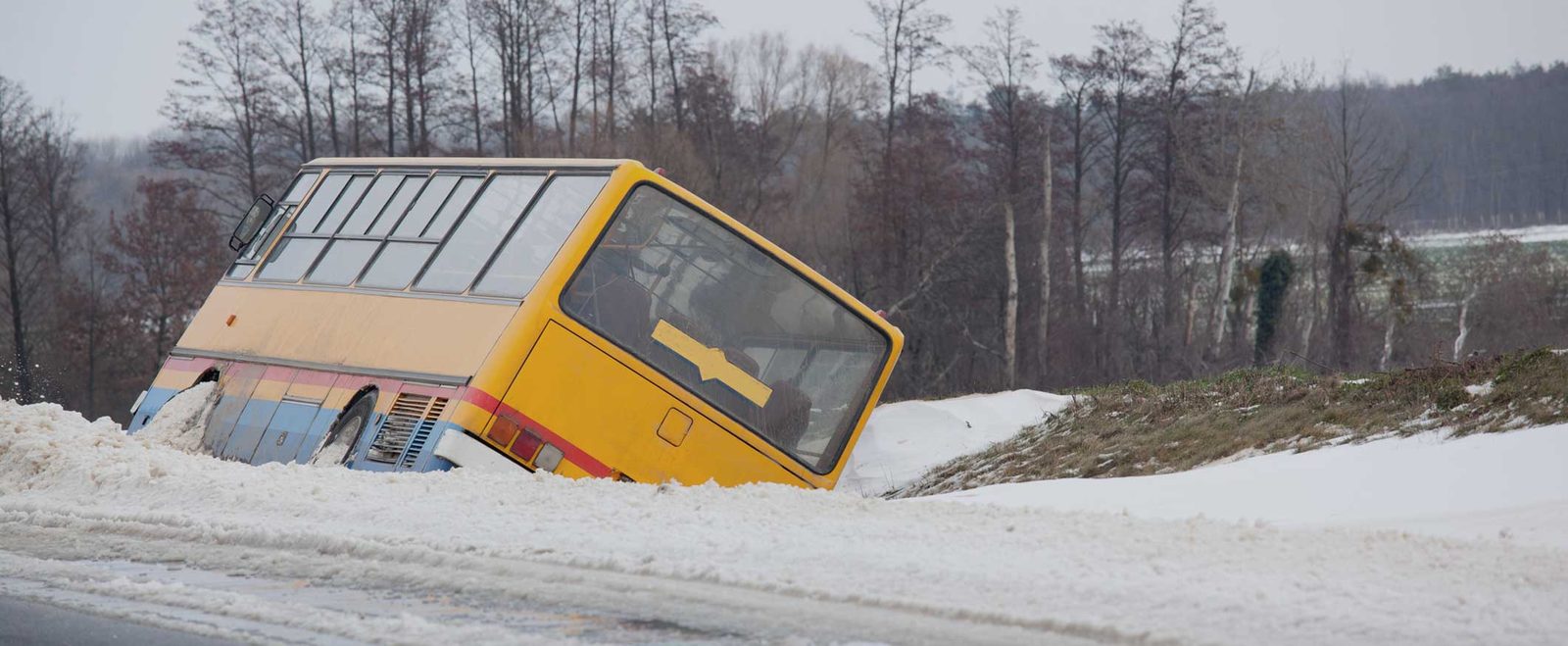 A bus run off the road into a ditch after a bus accident