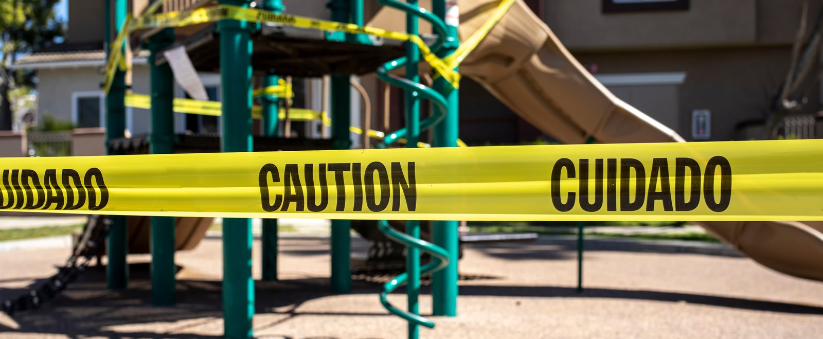 A playground closed off with caution tape after a hazard, the basis of a premises accident claim