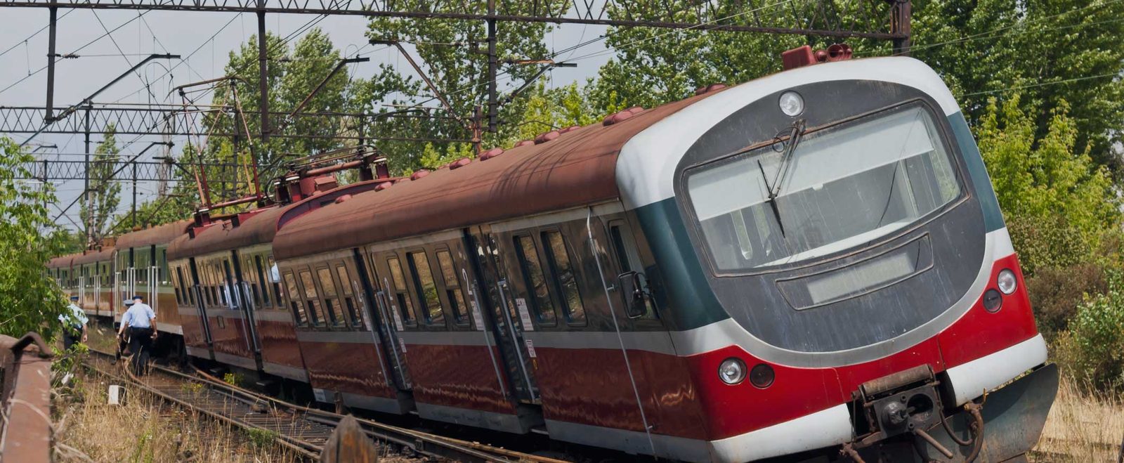 A passenger train moving along open tracks, the setting of many train accidents